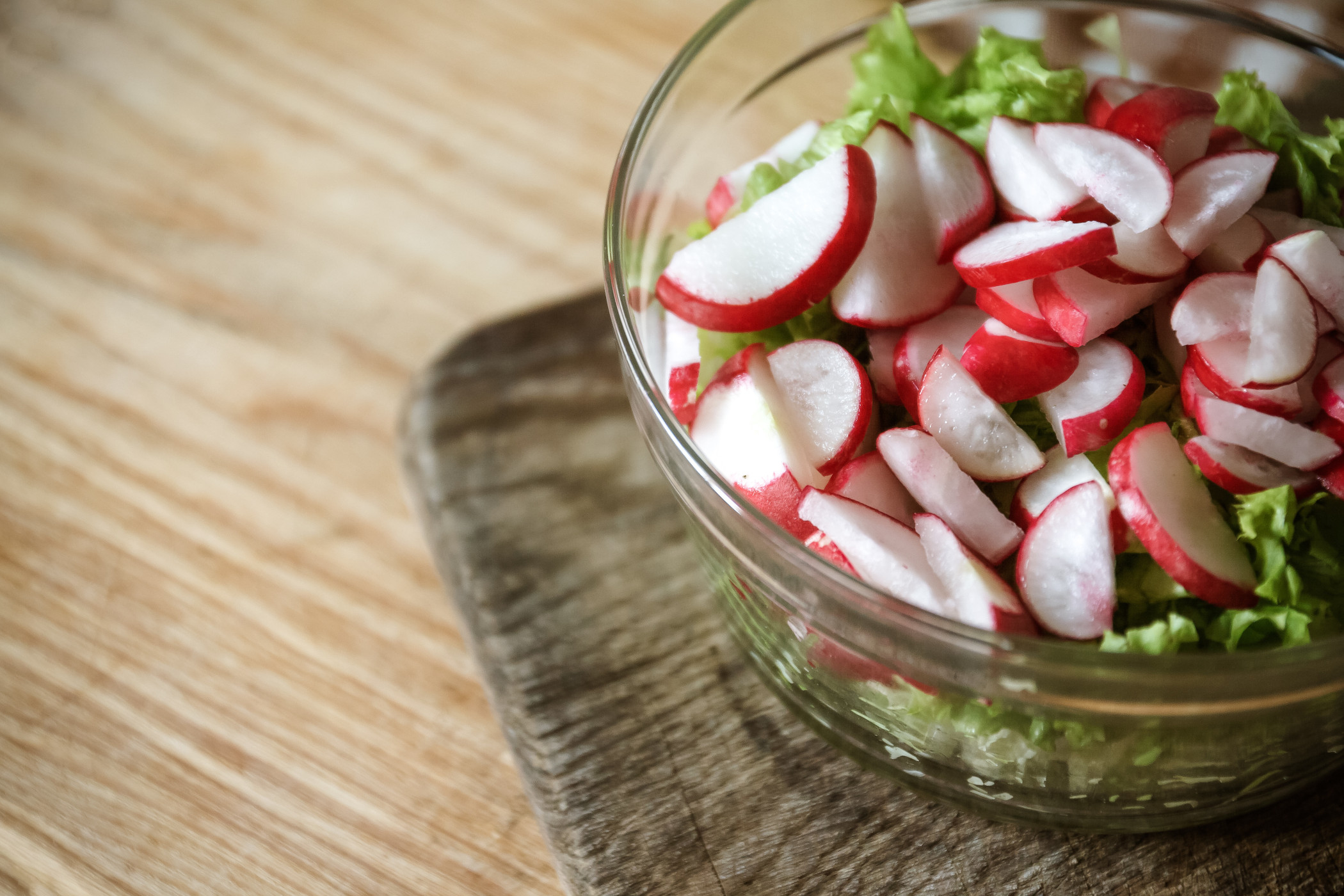 Vegetable vegan salad of wild garlic, radish, spring onions, cab